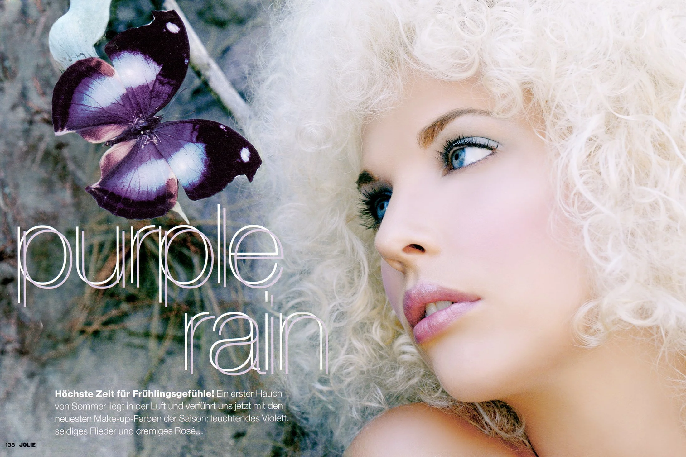 A woman with curly blonde hair gazes to the side, lying on the ground beside a purple butterfly on a branch. The text on the image reads 'purple rain' in large letters, with additional German text about spring feelings and makeup.