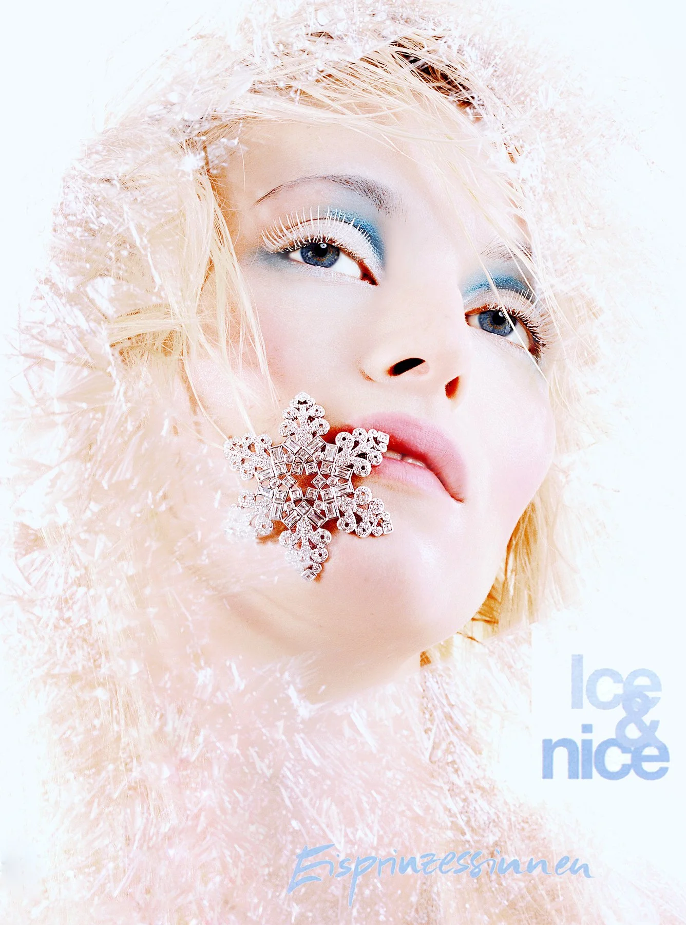 Close-up of a young woman with icy blue eye makeup, white eyelashes, and pastel pink lips, wearing a fluffy pink hood and a large, ornate snowflake earring. The background is white with icy accents, with the text 'ice & nice' and 'espinzzensunne' dis