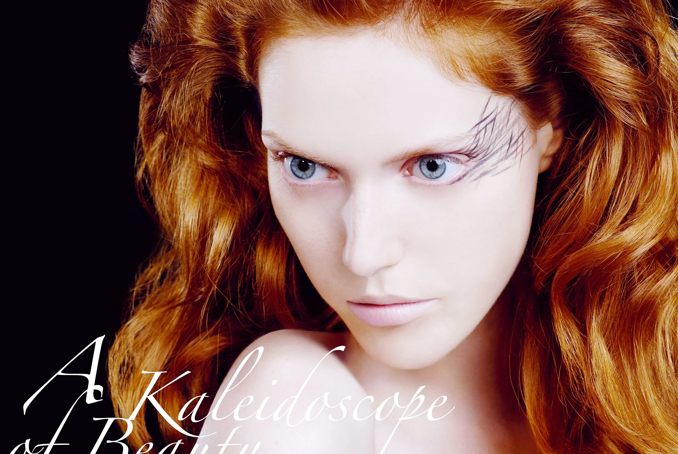 Close-up of a woman with red hair and blue eyes against a black background, with text overlay that reads 'A kaleidoscope of Beauty'.