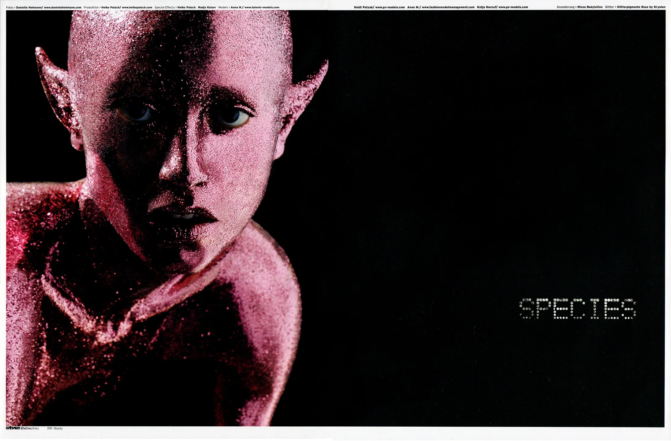A person with pale skin, biological features, and elf-like pointed ears, covered in pink glitter, with a serious facial expression against a black background. The word "SPECIES" is written in white dots on the right side of the image.