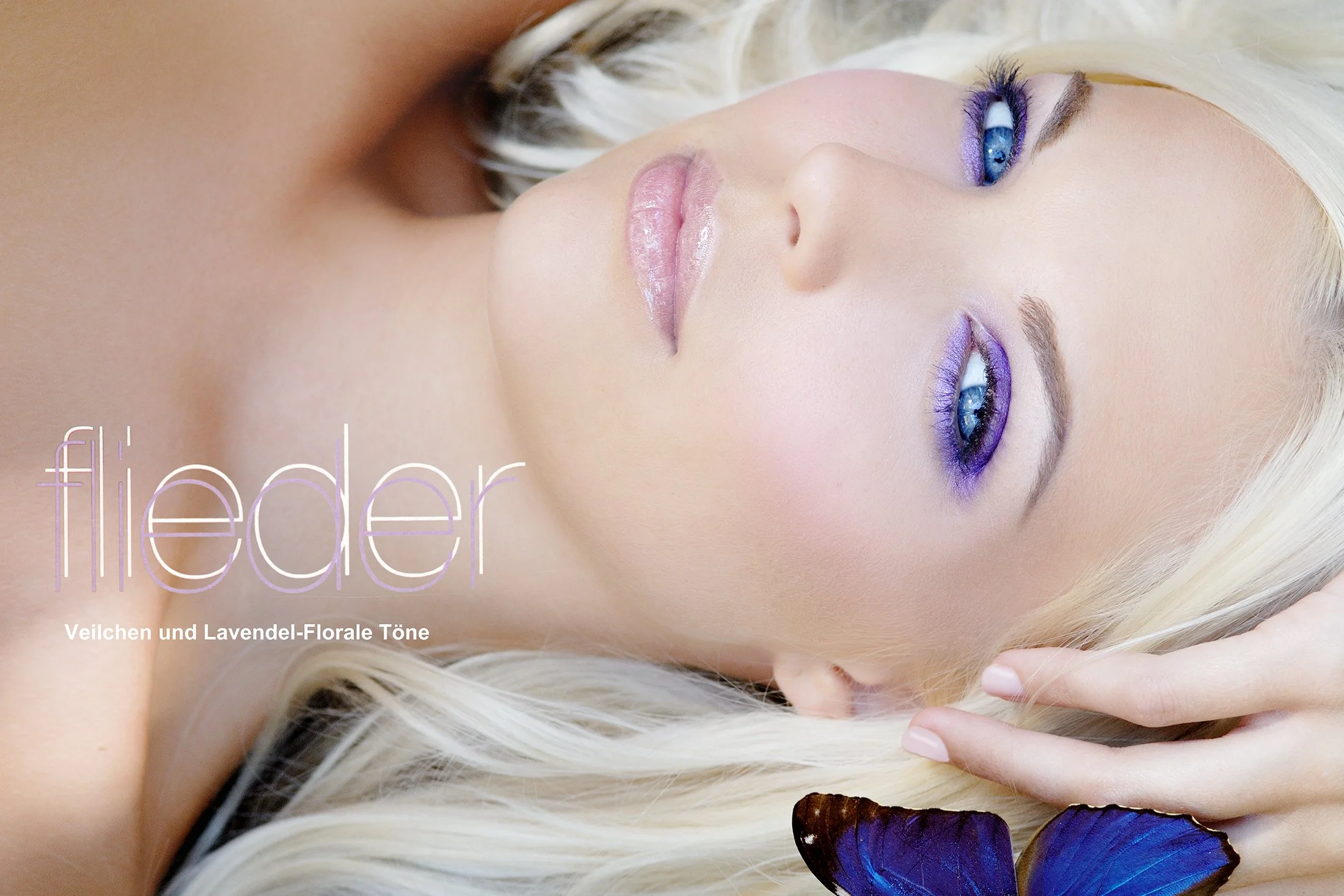 Close-up image of a woman with platinum blonde hair, blue eyes, and purple eye makeup, lying down with her hand near her face, with a purple butterfly near her shoulder. The text on the image reads "flieder" and "Veilchen und Lavendel-Florale Töne."