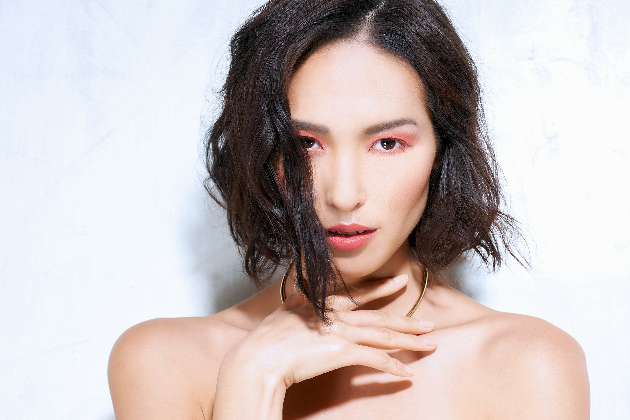 Commercial beauty photography for Youngblood Mineral Cosmetics (YB) featuring a sophisticated makeup look with soft pink eyeshadow and a natural lip. Captured by beauty photographer Daniella Hehmann, the image utilizes bright, clean lighting to showc