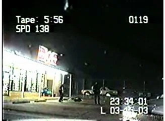 The suspect has been shot several times and has fallen.