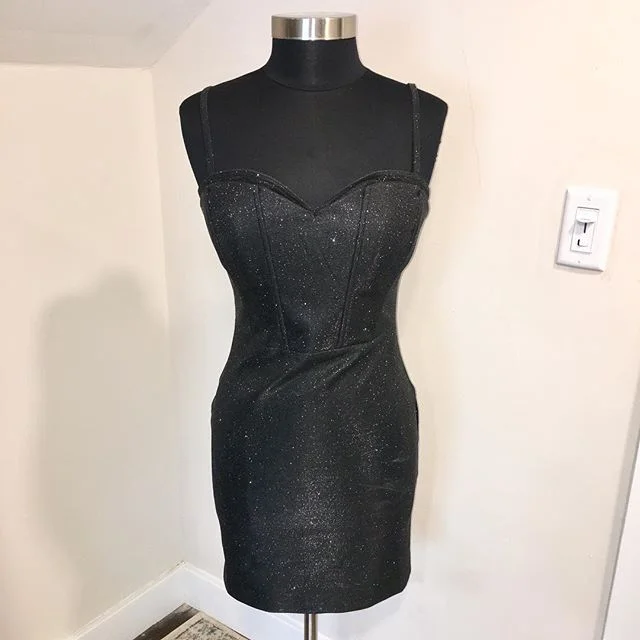 NOW AVAILABLE: WOW Couture Black Metallic Corset Fit Mini Dress, Size L. $30. Turn heads at any holiday party in this Bodycon corset-style mini dress by WOW Couture! Fabric is black with silver metallic specks, in perfect condition. Back zip with hoo