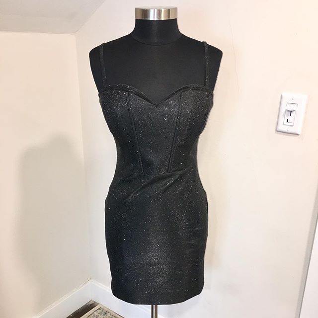 NOW AVAILABLE: WOW Couture Black Metallic Corset Fit Mini Dress, Size L. $30. Turn heads at any holiday party in this Bodycon corset-style mini dress by WOW Couture! Fabric is black with silver metallic specks, in perfect condition. Back zip with hoo