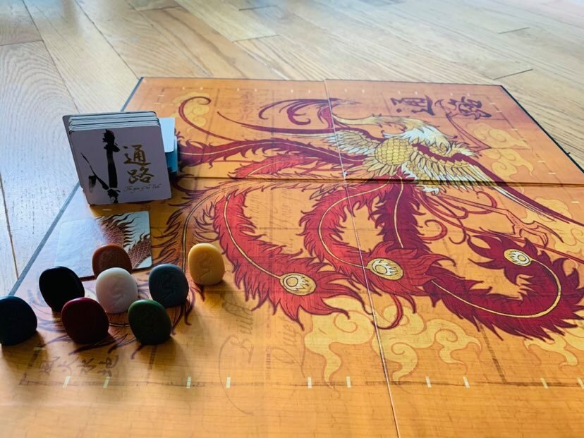 Tsuro game board, game pieces and game tiles