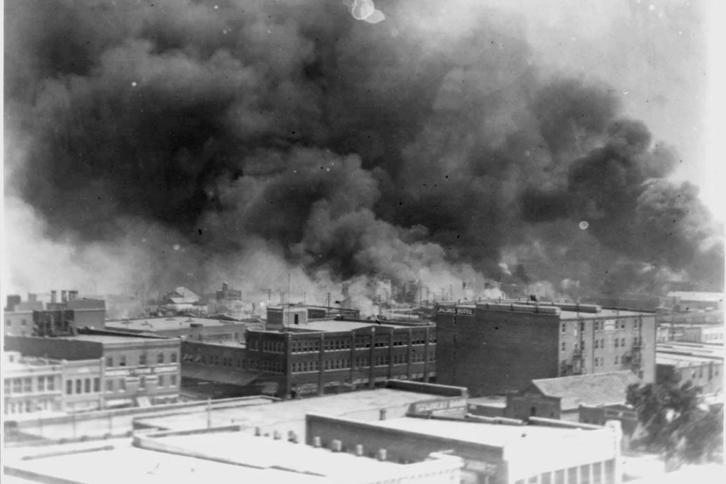 "Smoke billowing over Tulsa, Oklahoma during 1921 massacre c/o Library of Congress