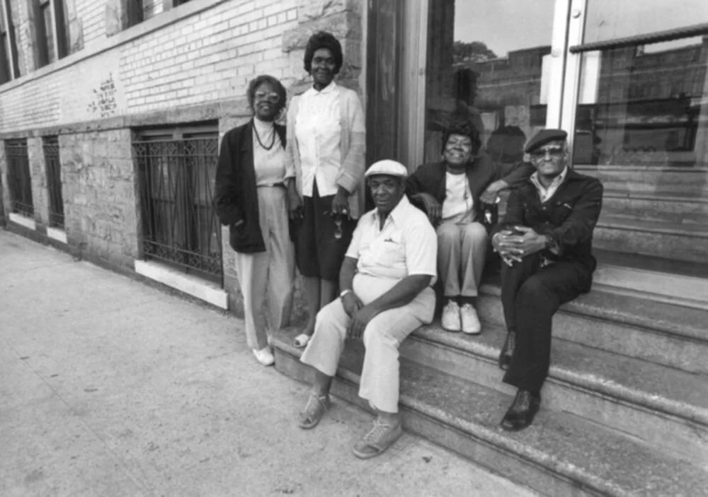 A group of shareholders in front of their building in New York. Between 1978 and 1988, 242,000 housing units in the city were converted to co-ops. Care of UHAB