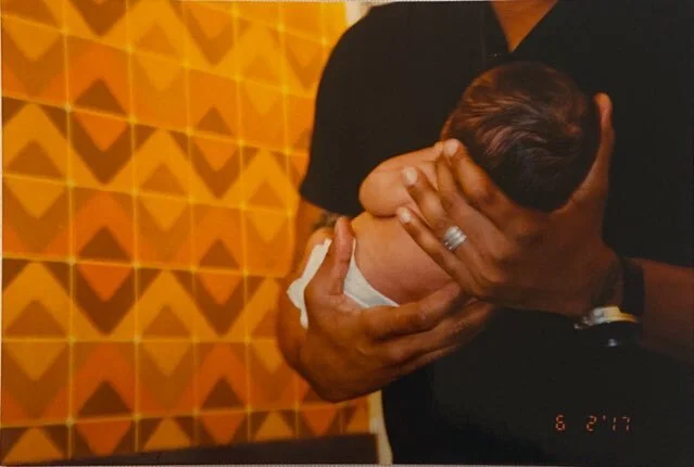 Kacey Greene holding Logan Greene