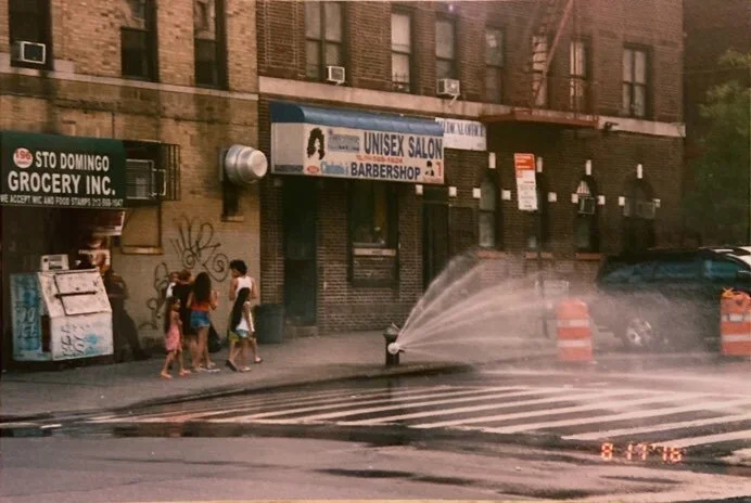 New York’s children still play in fire hydrant water