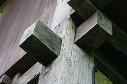 Two story Ulin post and beam construction showing mortise join which weakens the wood structure - a big fat no-no