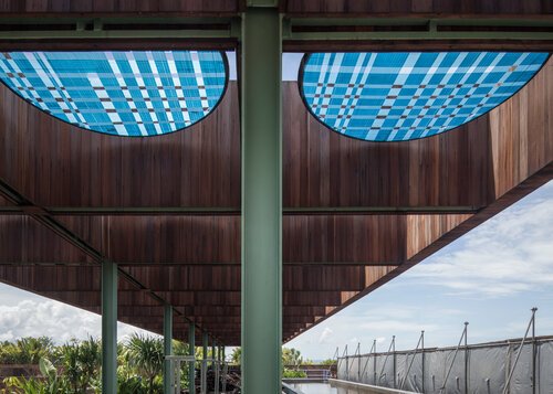 Geometry, framed through perspective.
At Desa Potato Head, reclaimed timber panels meet steel and shadow in a composition of lines and repetition. Seen from below, the ceiling becomes a quiet study in proportion, texture, and light.

Our reclaimed wo