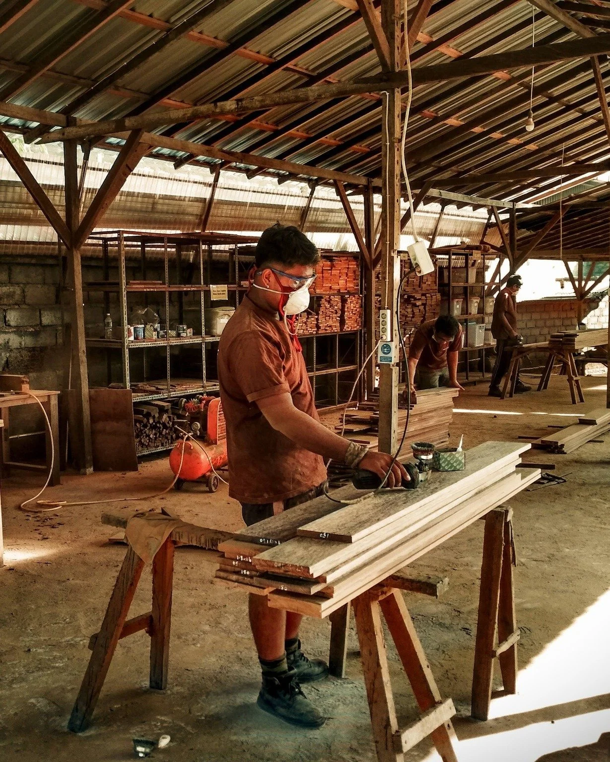 Every piece of reclaimed wood that leaves our workshop carries a story &mdash; of craftsmanship, sustainability, and dedication.
Our team carefully restores each board by hand, giving new life to timber once part of Indonesia&rsquo;s architectural he