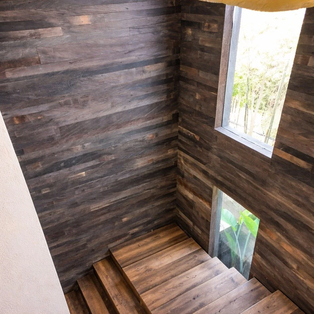 Staircases are often passed through, rarely designed.
Reclaimed wood wall paneling adds texture, warmth, and a sense of continuity to this in-between space, turning everyday movement into a quiet design experience.

Because even the most overlooked a