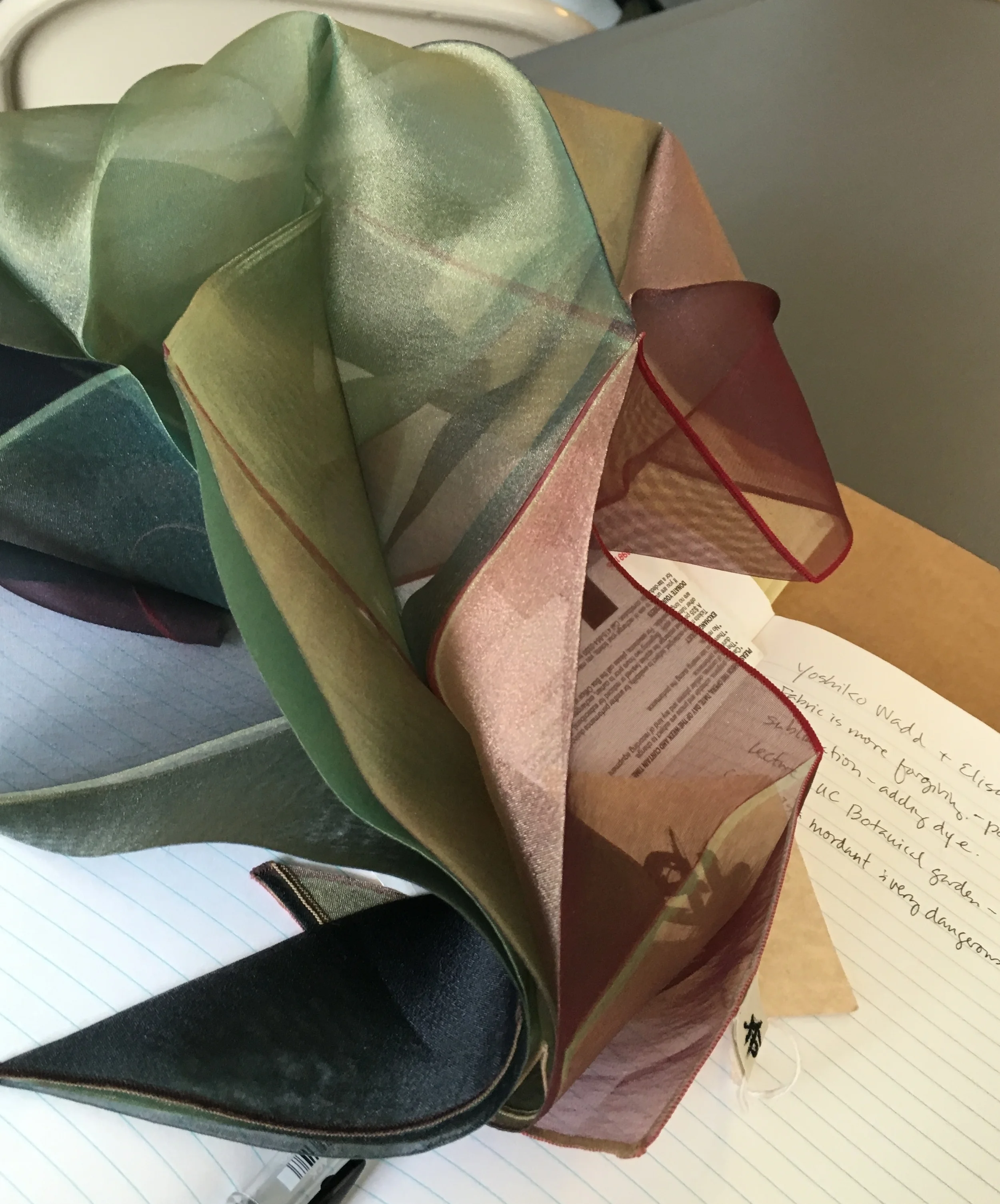 polyester folded, pressed, dyed, pressed again.