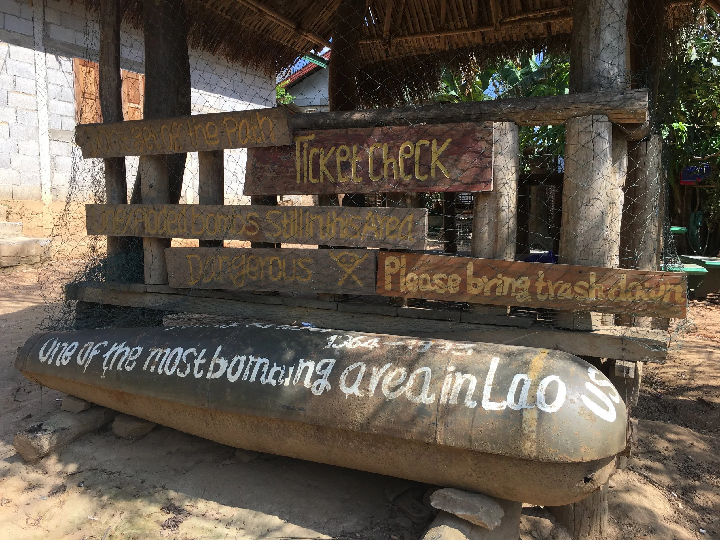 "One of the most bombing area in Lao." A U.S. bomb casing at a trailhead in Muang Ngoi.