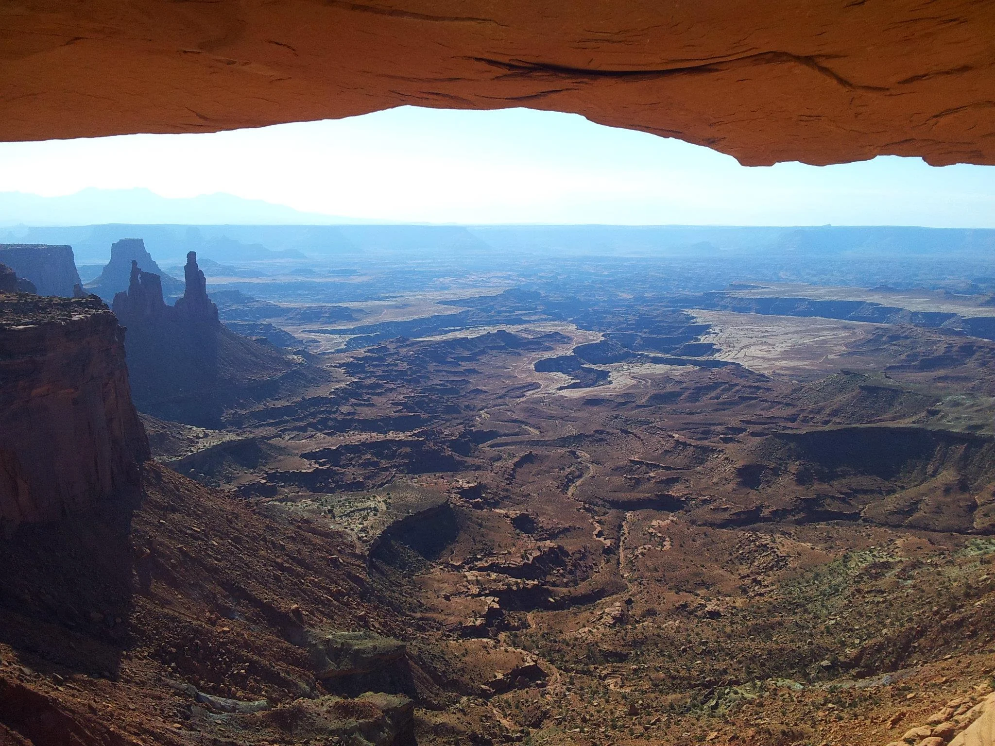 The view of Canyonlands from under the arch