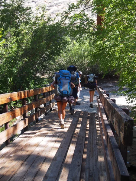 Crossing the wooden bridge and reaching a junction