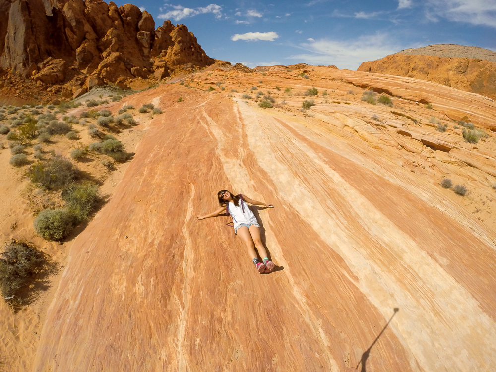 The edge of the sandy trail and the slick rock