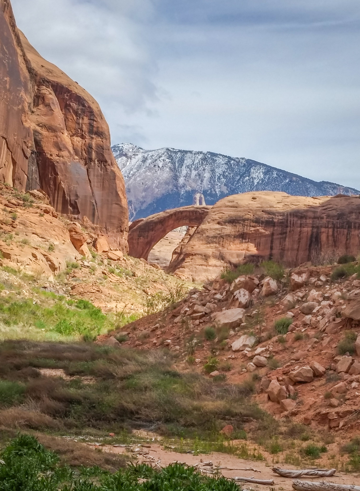 The first view of Rainbow Bridge and snowy Navajo Mountain from the trail