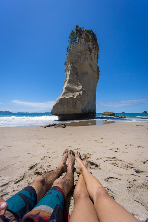 Lounging on a beach in hahei new zealand