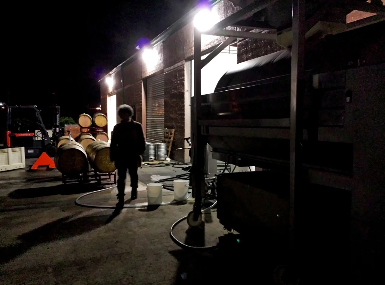 pressing silhouette among barrels.jpg