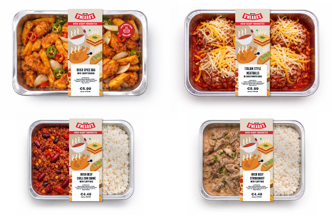Four pre-packaged Irish-themed frozen meals in aluminum trays with labels: Irish Spice Bag with crispy chicken, Italian style meatballs in tomato sauce, Irish beef chili con carne with rice, and Irish beef stroganoff with rice.