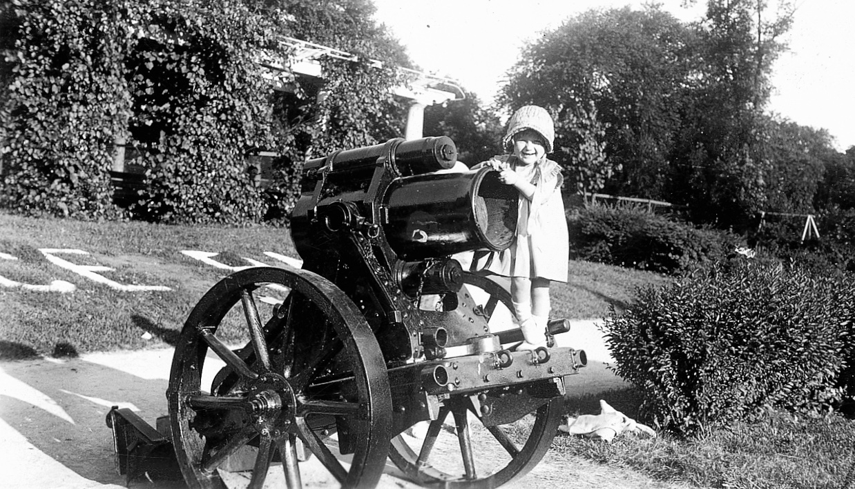 Shirley Steiner, neé Hagen, of the 3800 block of N. Ridgeway, playing on the cannon in Independence Park, circa 1933