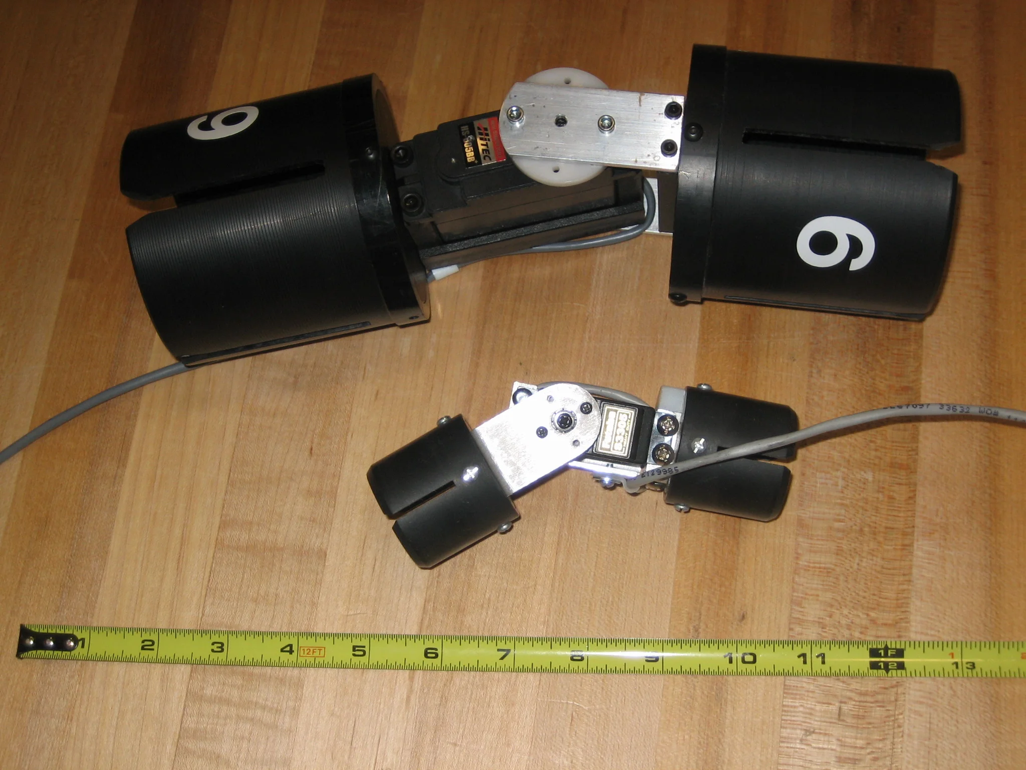  Large and small robotic joints. Larger joint use to construct human scale walking robot prototype from three inch cardboard mailing tube.   