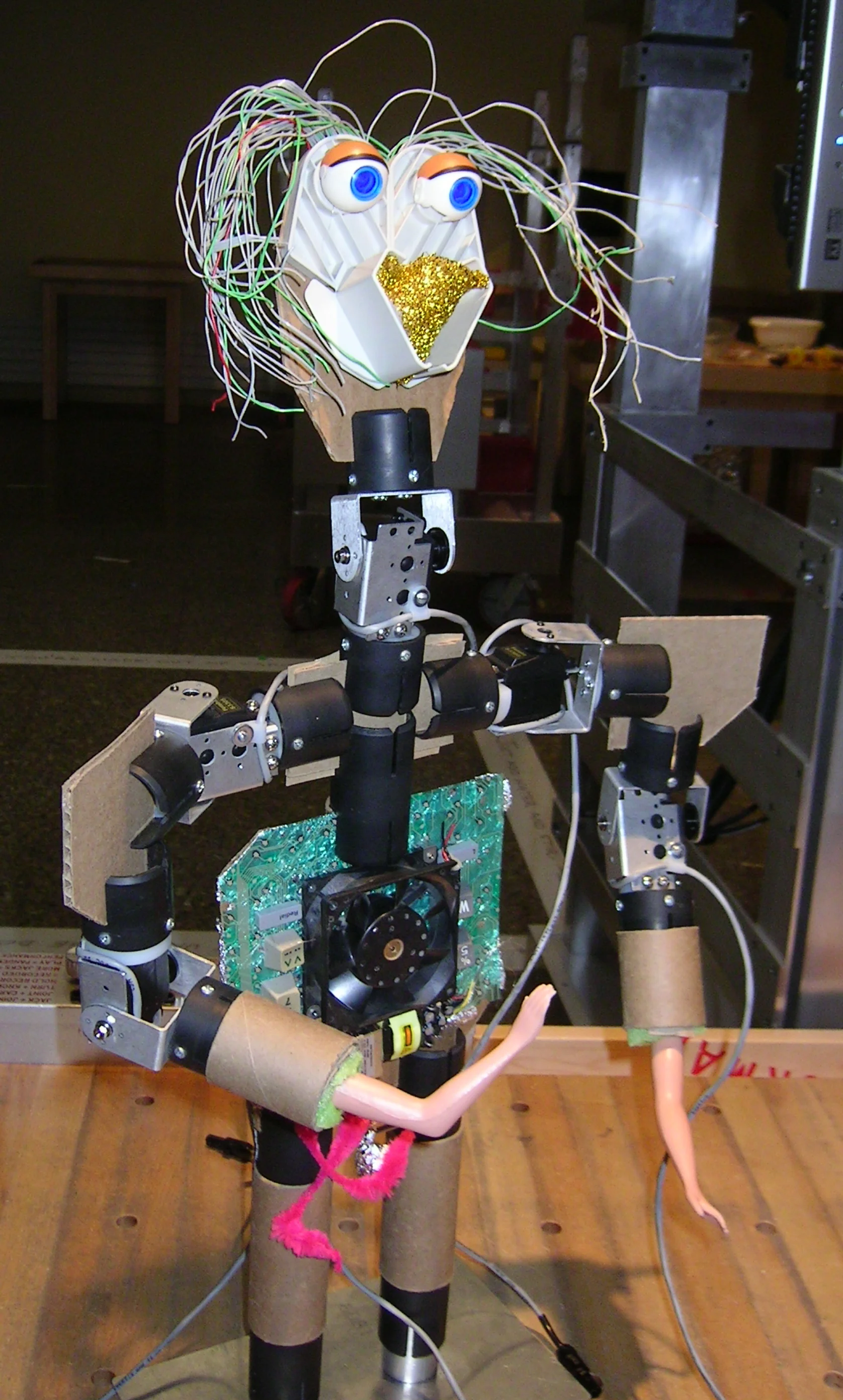   Robot puppet made with cardboard sheets, tubes and found materials.  