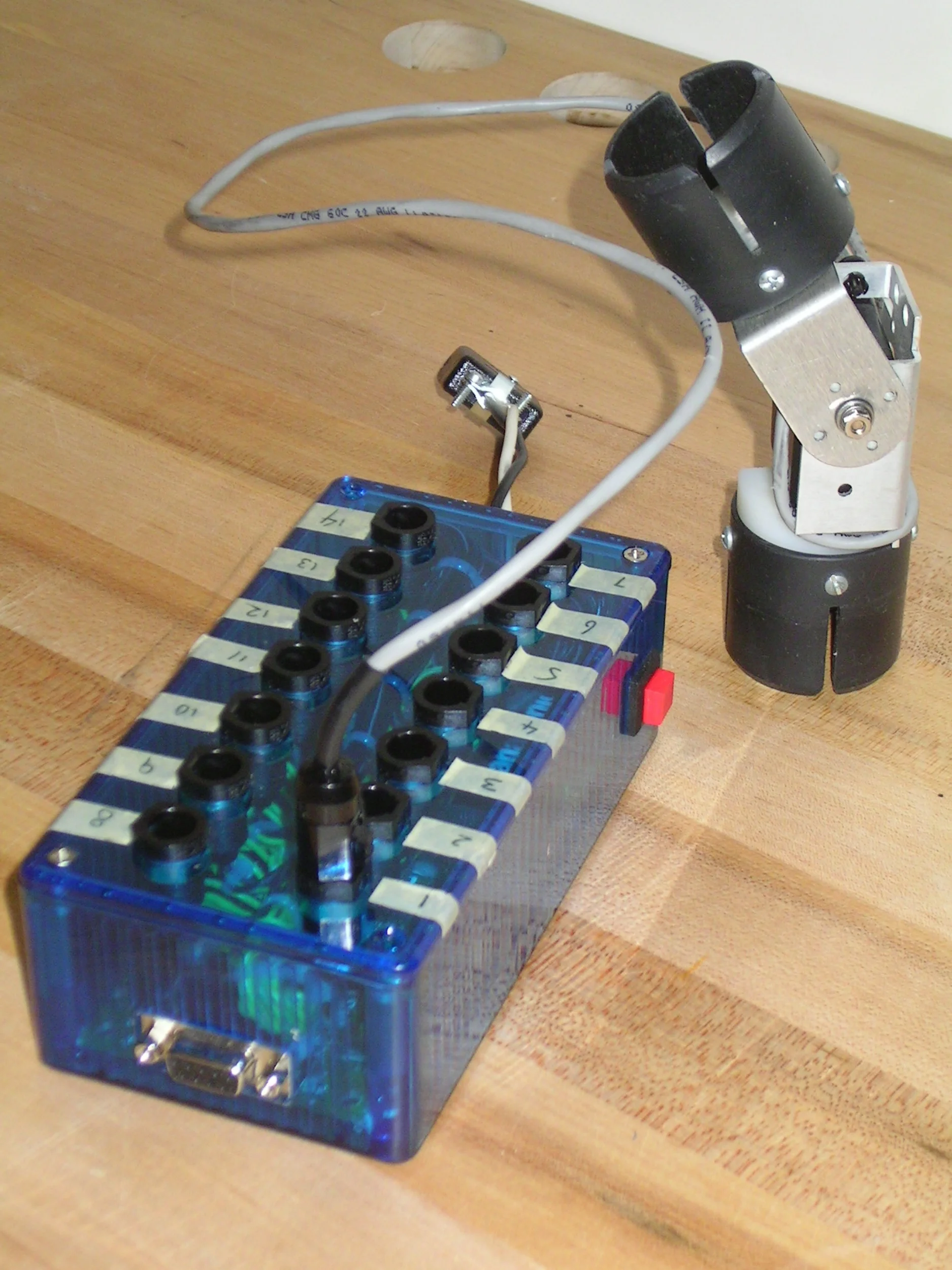  Custom built fourteen channel controller and small robotic joint.     