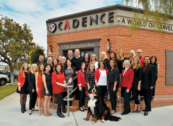 A group of very happy travel specialists in front of the Cadence headquarters in La Jolla, CA.