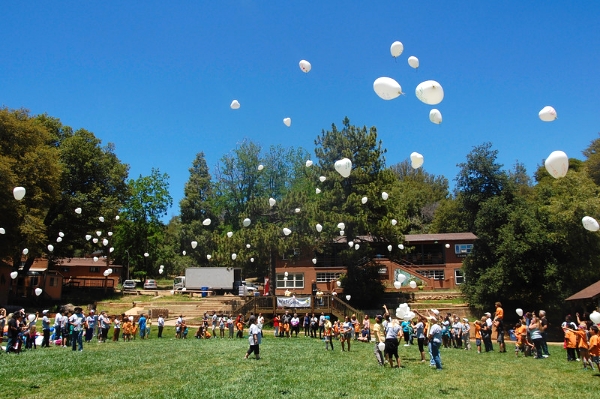 Above: a glimpse of the Balloon Releasing Ceremony. On the last day of camp, parents join the kids to write something on a balloon and release it into the air for their loved one.