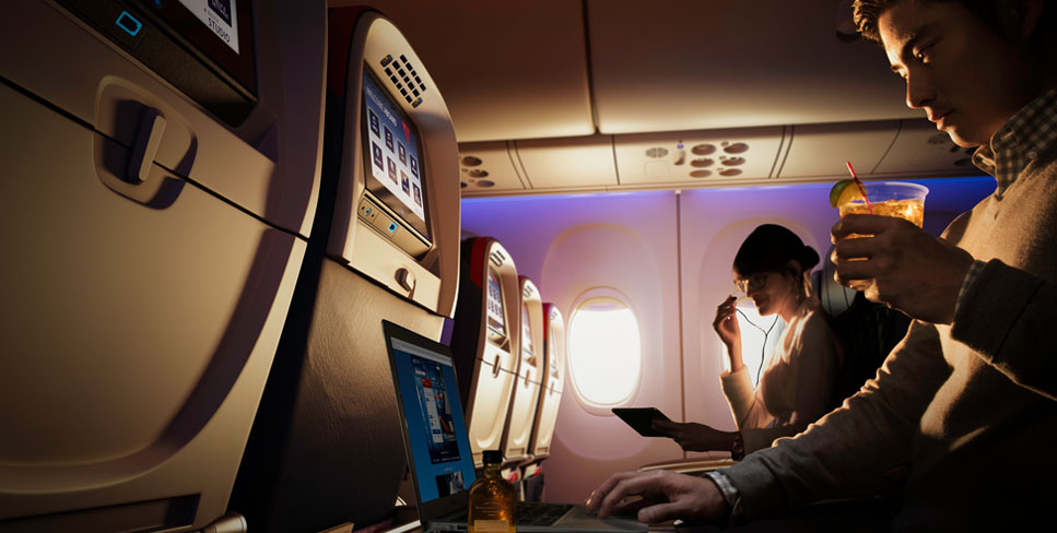 Cheers to the little things in life, like free drinks and extra legroom. Photo Courtesy Delta Airlines.