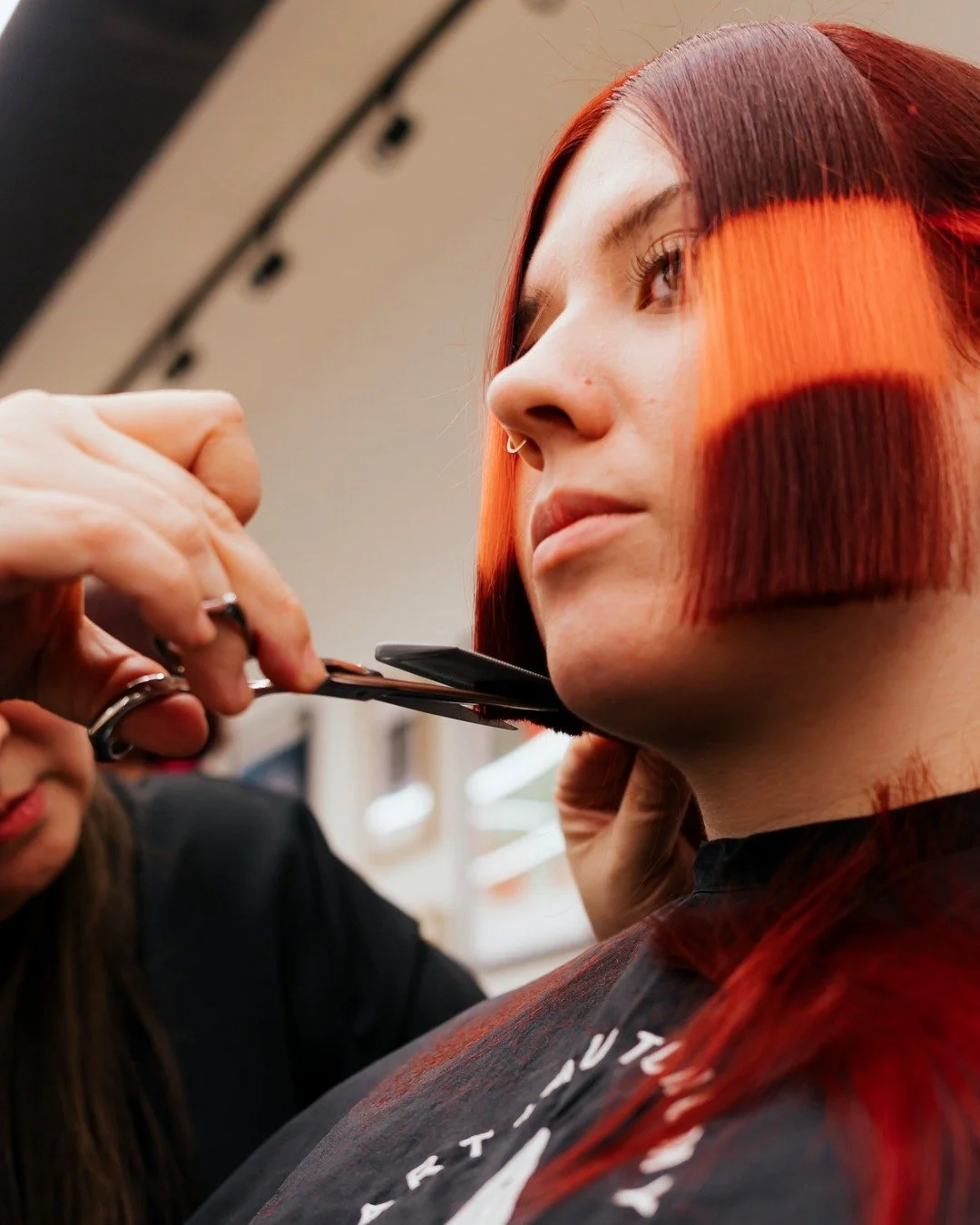 Cassadee came in with a clear reference: Lola from Shark Tale.

Where one salon saw limitation, Noelle (@chennoelle) saw possibility.

Using avant-garde shine line color placement paired with a precision cut, the result is glossy, confident, and unap