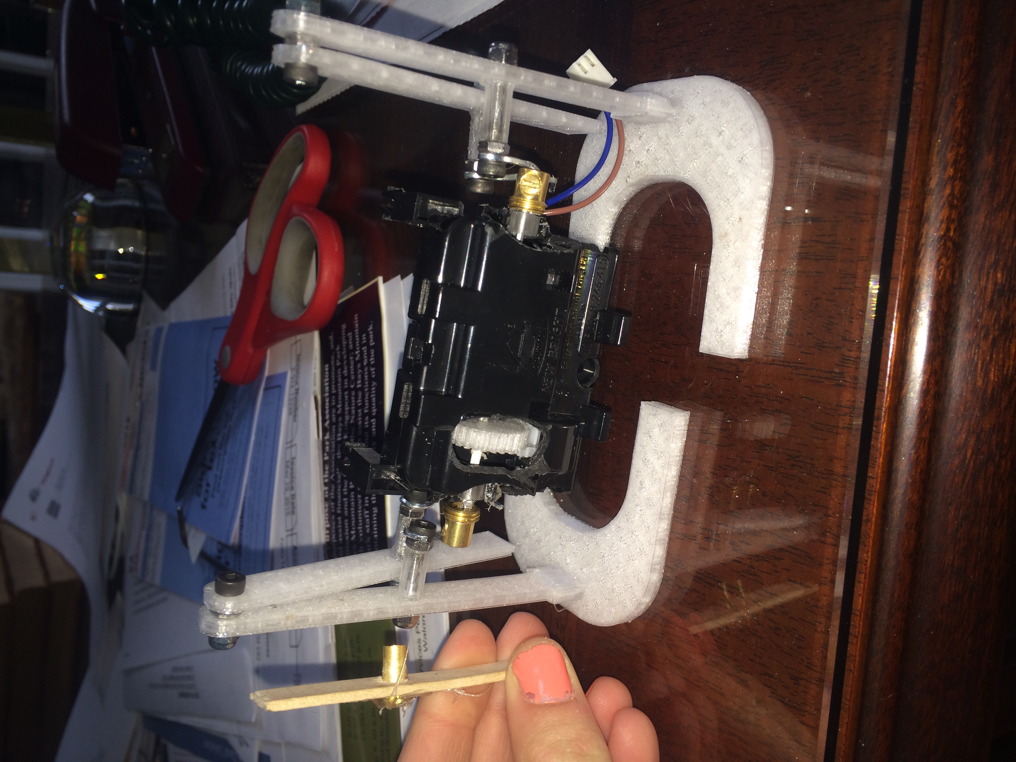 A modded RC car motor. I designed the gear, legs, and feet. The printed legs replace the Popsicle stick with brass tube.