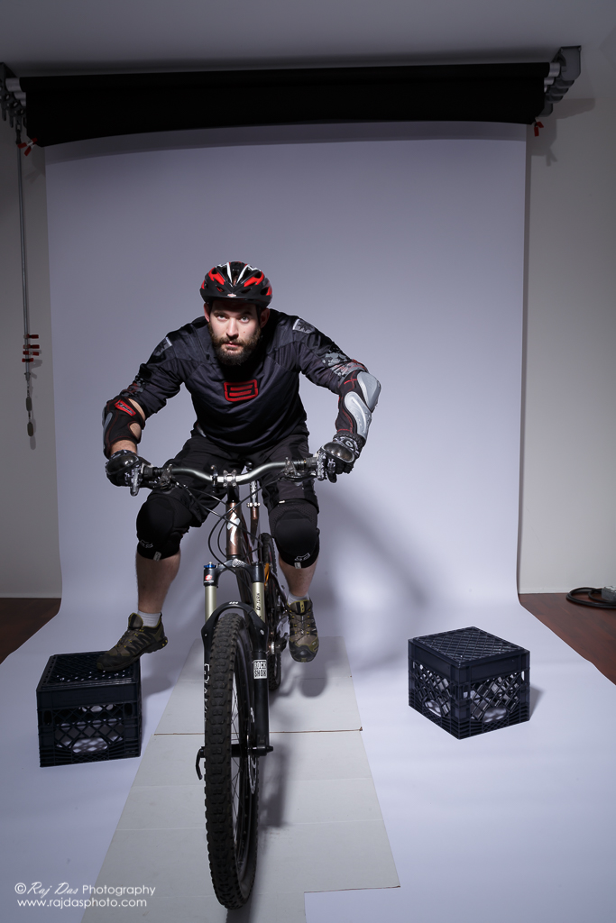 Jason on his bike in the studio with left foot on pedal