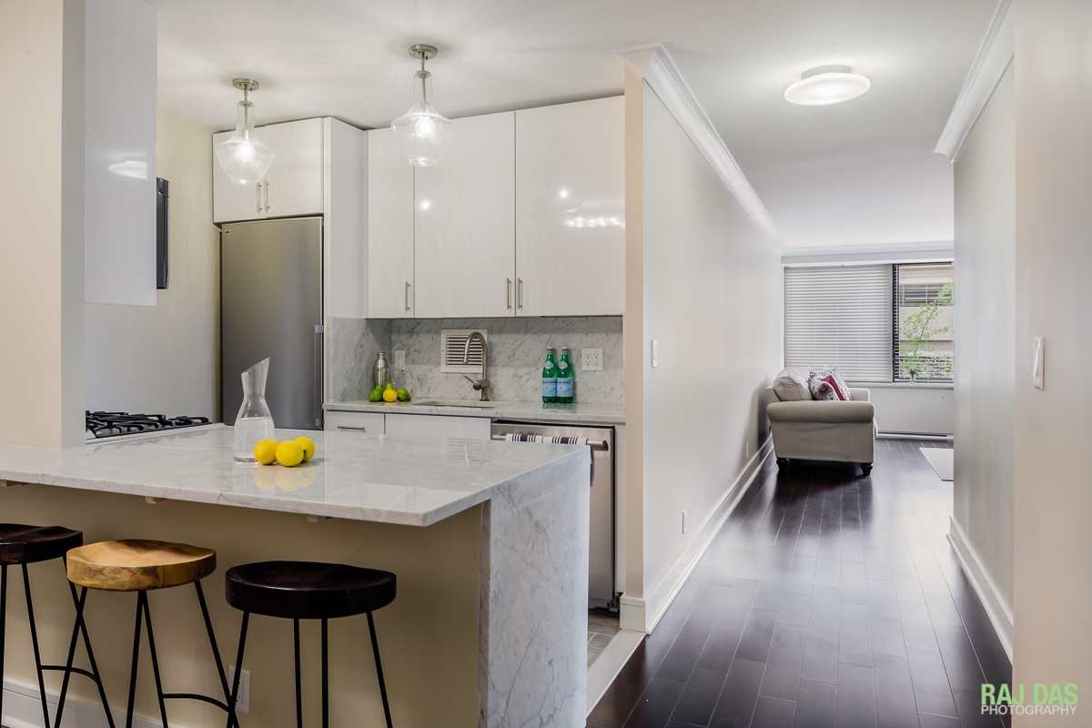 View of kitchen, hallway and living room at the Harbor Towers property