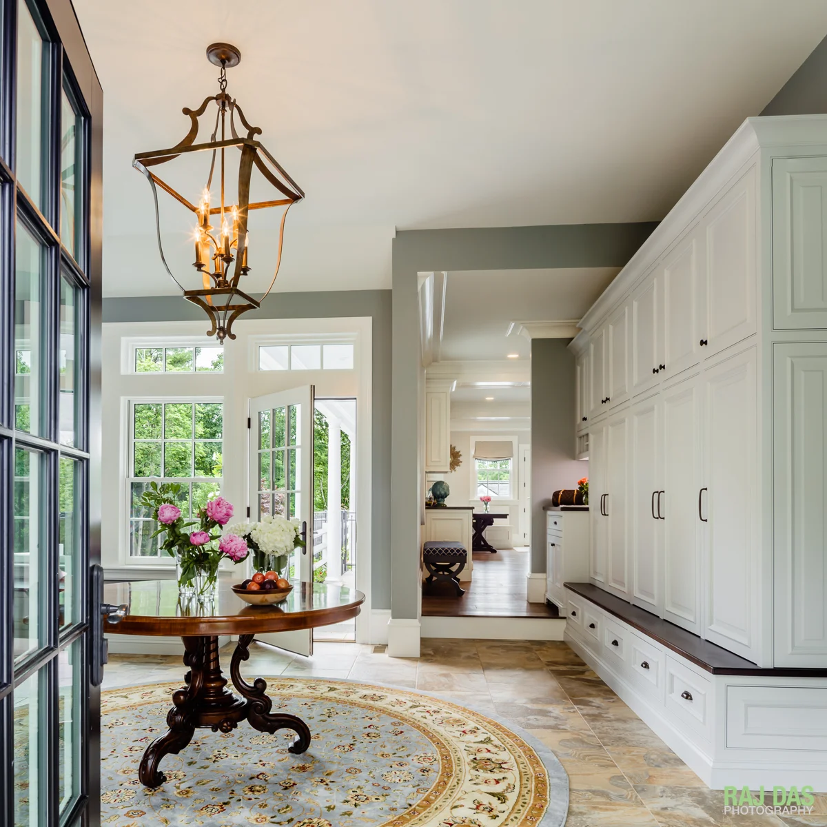 Mud room and view into outdoor patio and kitchen area