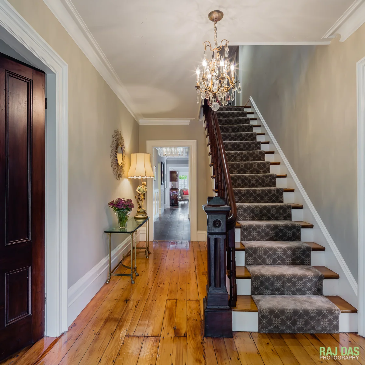 Main entrance and staircase and a view into the newer section of the residence