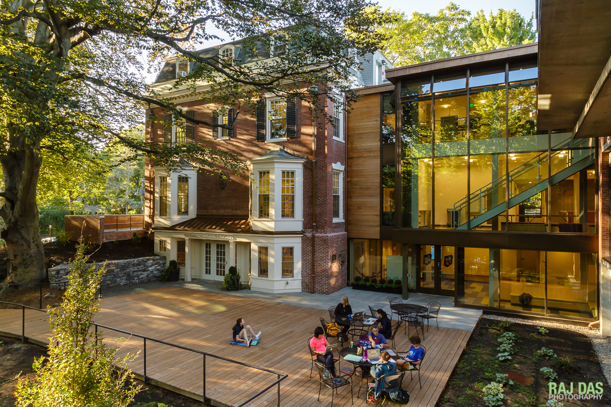 Students enjoying the new terrace on a warm autumn afternoon