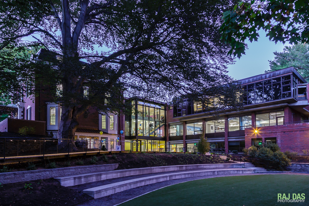A view of the boardwalk and new foyer of the school building at dusk