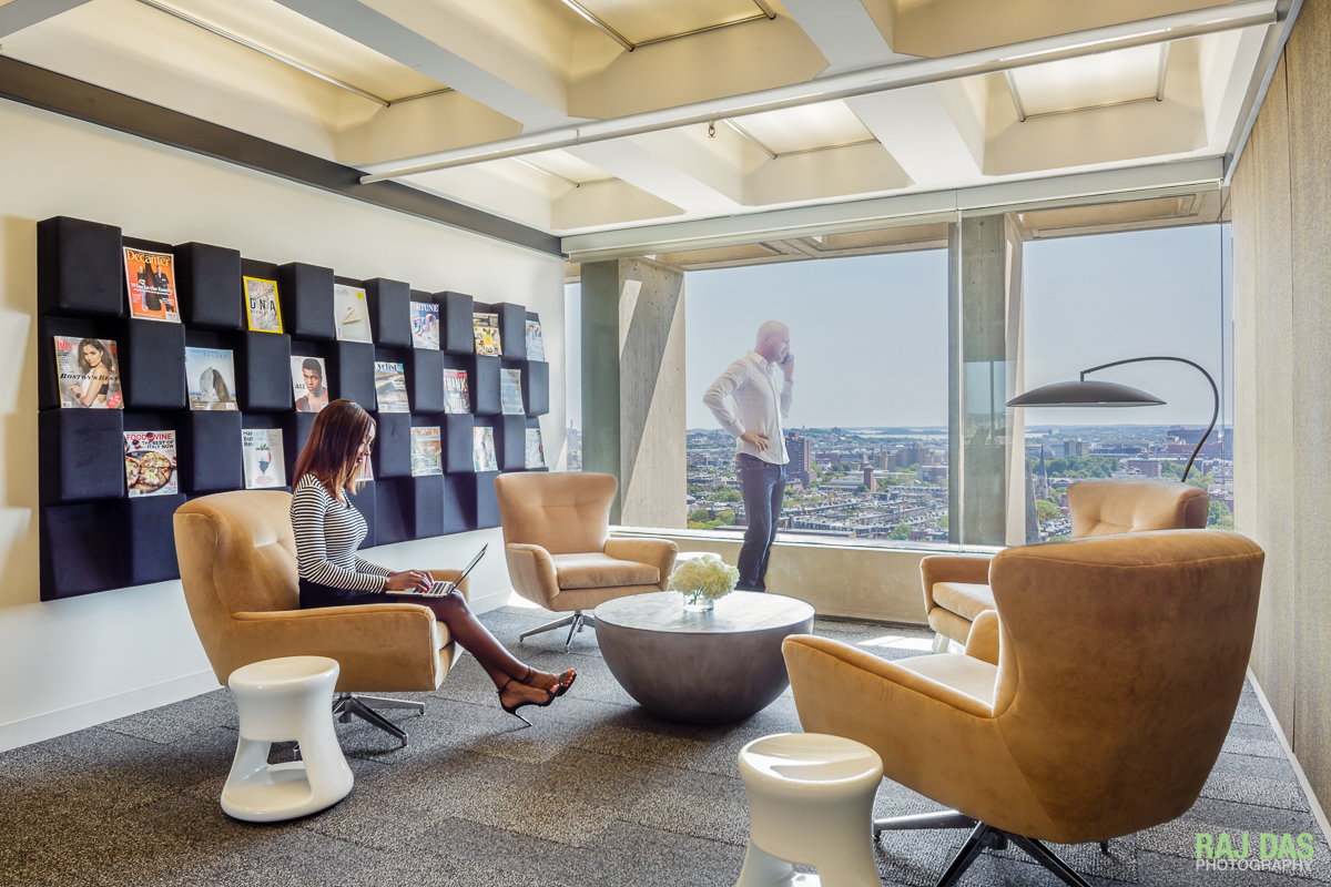 One of the common areas at Business District with plush sofas and sweeping views