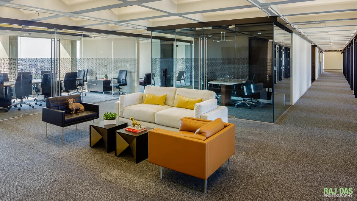 Living room and a view of the conference rooms, offices and hallway