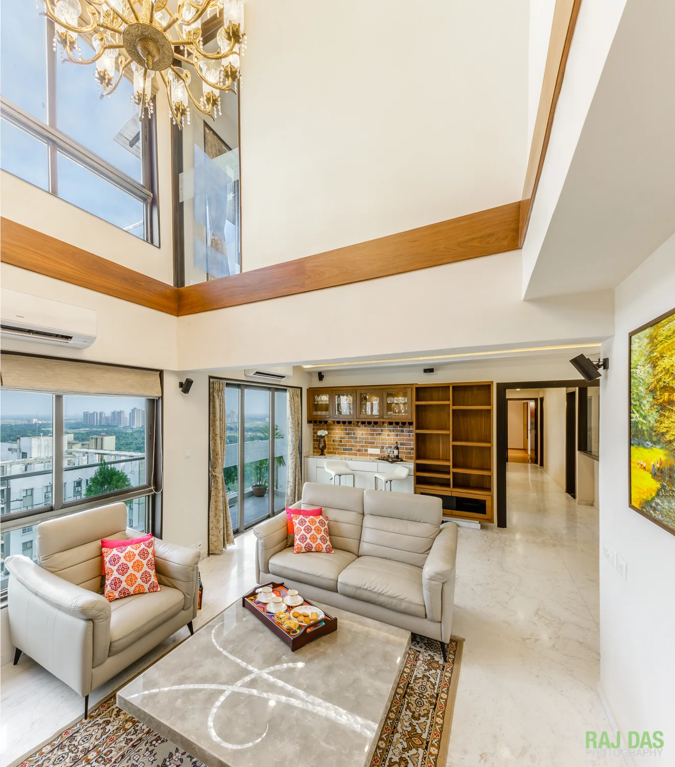 Another view of the living room, bar and the hallway leading to the dining and kitchen areas