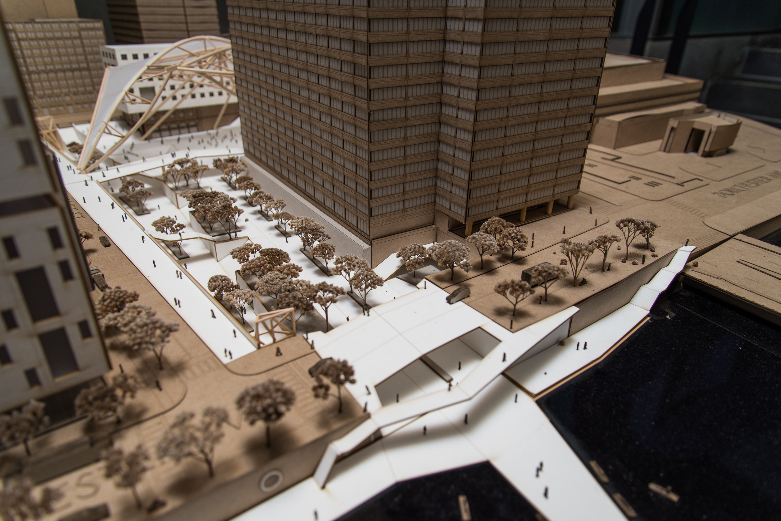 The plaza allows a gentle transition from on grade development to the tracks.