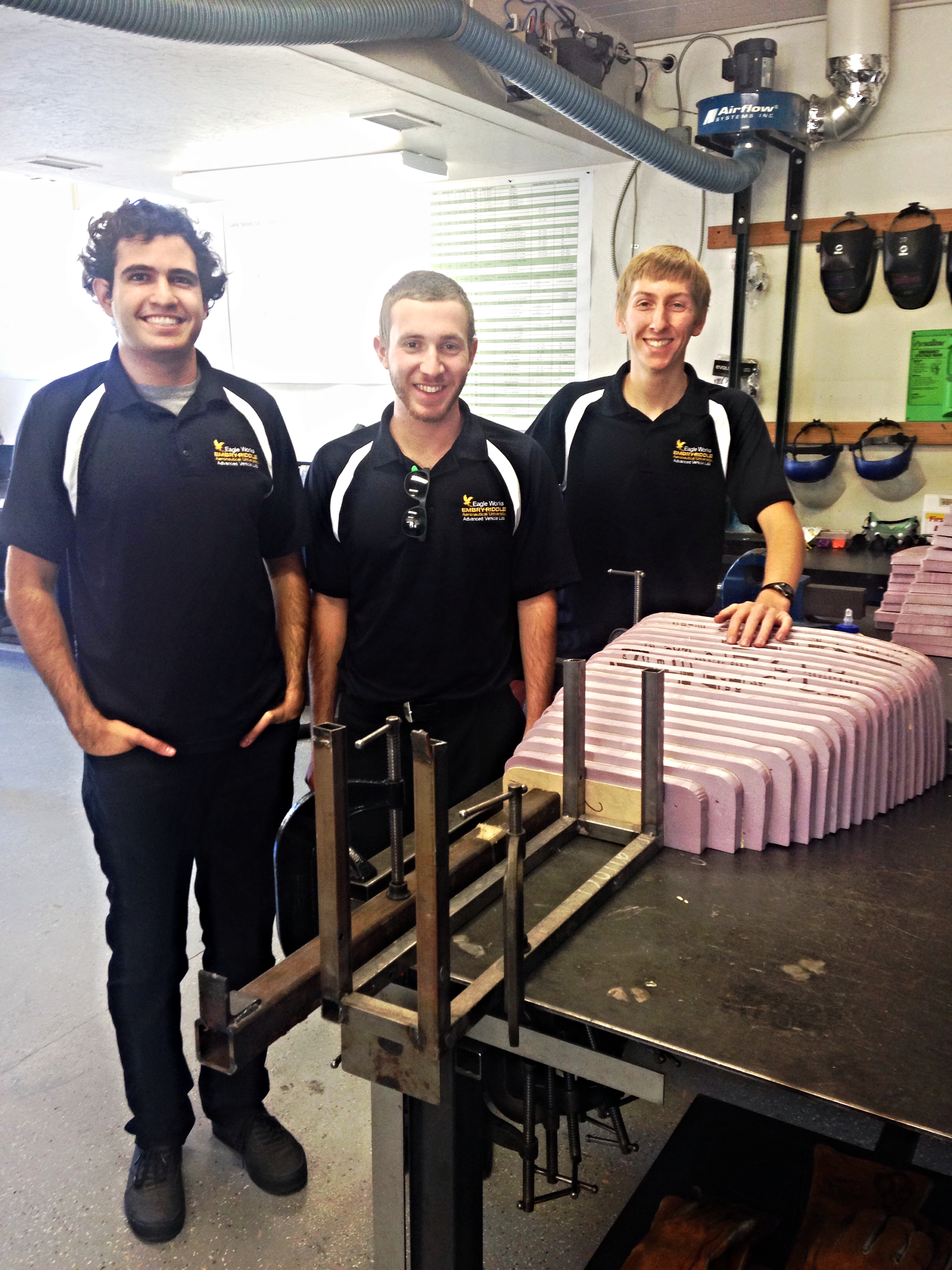 The AeroShell Team secure an arrangement of foam boards to allow the adhesive to completely dry. Right to left: Reece Ticotin, Phil Elterman, and Brian Ferguson