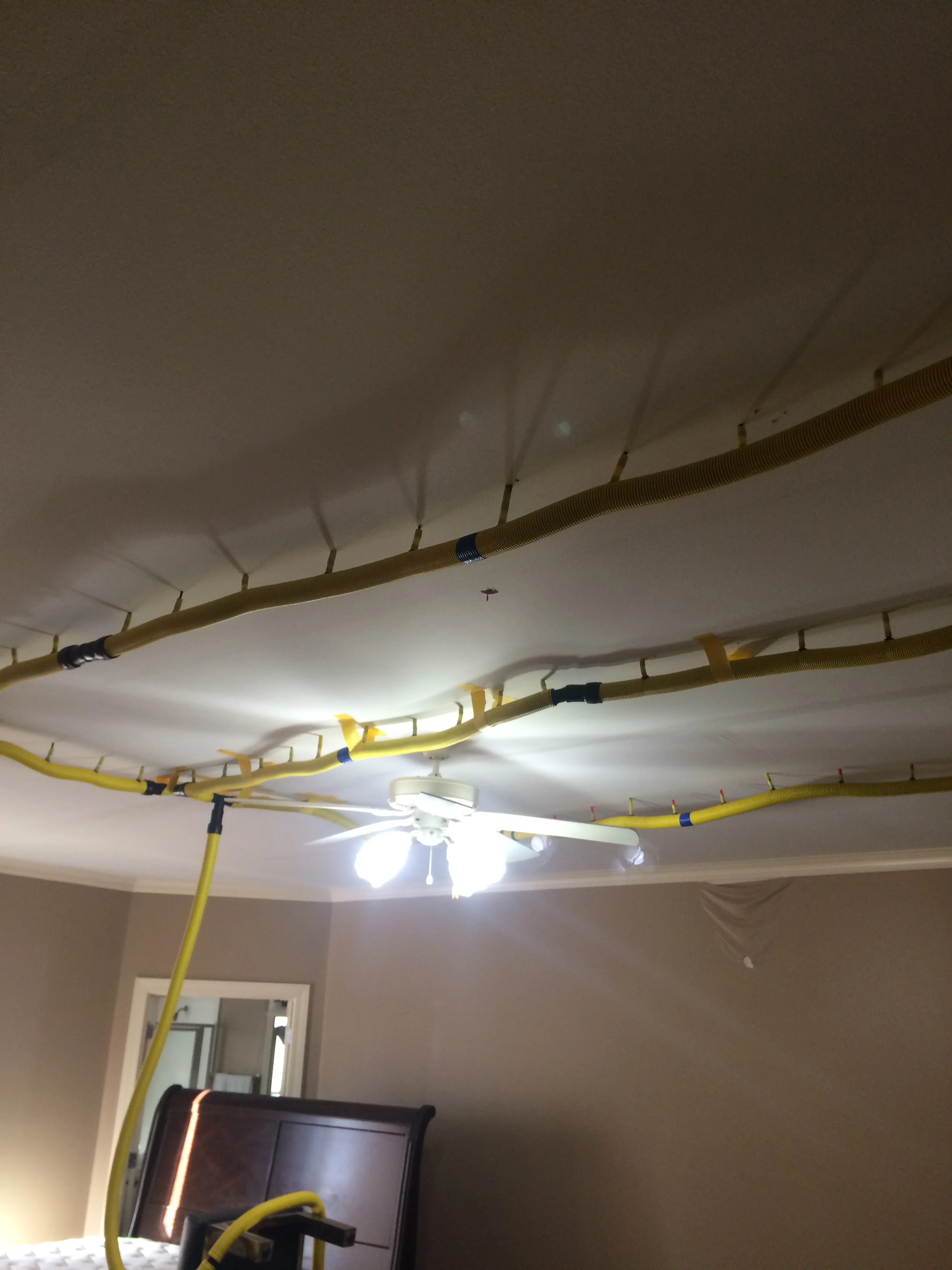   Drying the bedroom ceiling and the sub-floor to the game room above at the same time  
