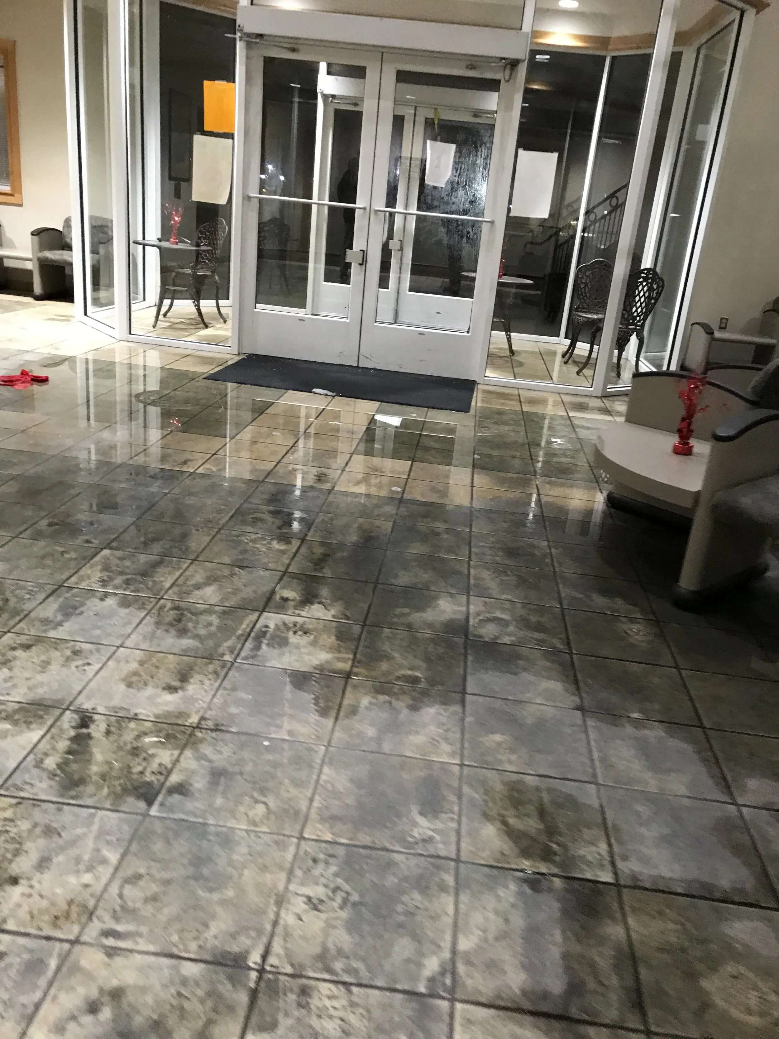   Fire suppression damage to tile floor prior to clean up  