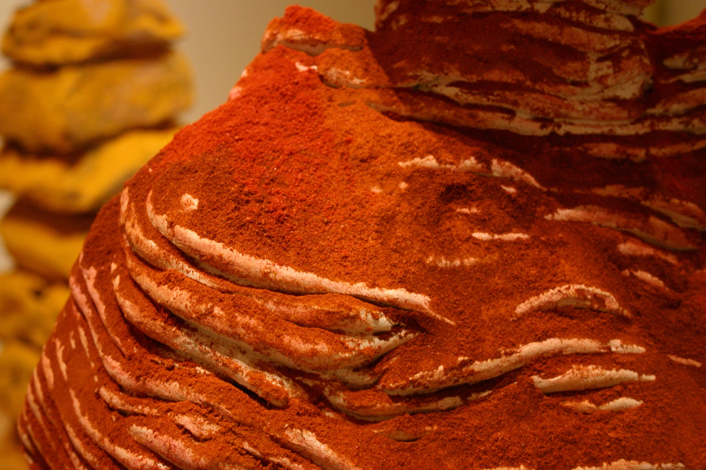 Detail of the red spice on the ceramic sculpture